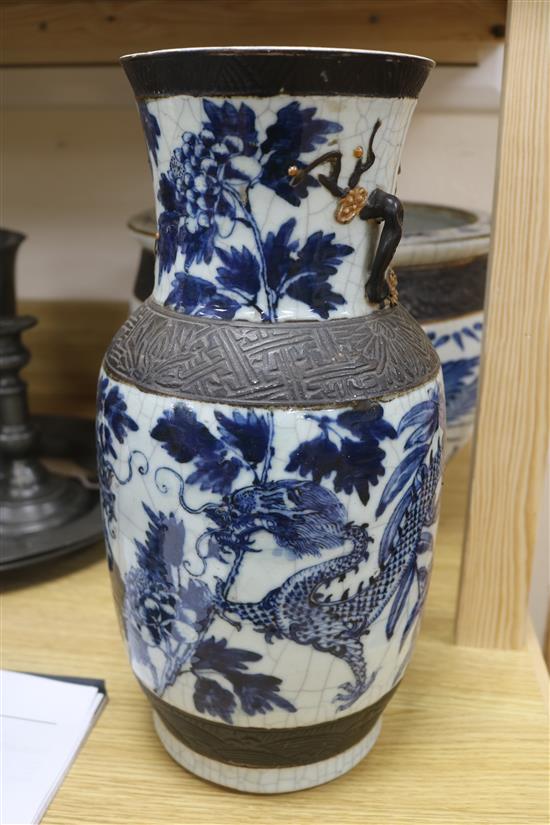 A Chinese blue and white crackleglaze jardiniere and two vases